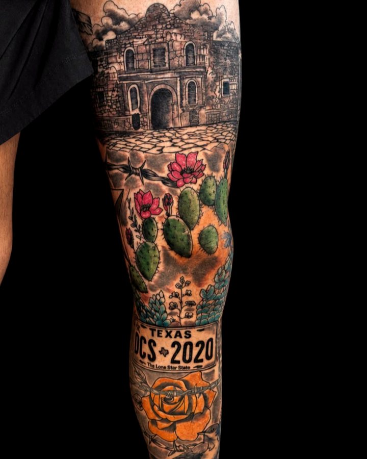 Full-color Texas leg sleeve — the Alamo above prickly pear in bloom and a Lone Star plate, running the length of the shin.